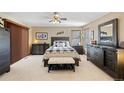 Serene bedroom featuring neutral tones, a comfortable bed, ample closet space, and soft natural light at 5370 W 74Th Ave, Arvada, CO 80003