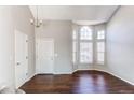 Bright foyer with hardwood floors and a large window, creating a welcoming entrance at 10406 Drake Pl, Parker, CO 80134