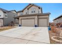 Spacious home featuring a large driveway, well-maintained landscaping, and a three-car garage for ample parking at 12863 Crane River Dr, Firestone, CO 80504