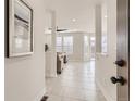 Inviting entryway with tiled floor that leads into a sunlit living space at 12213 Joplin St, Commerce City, CO 80603