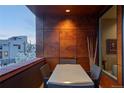 Cozy balcony with modern table and chairs, perfect for enjoying outdoor meals with cityscape views at 1919 W 32Nd Ave, Denver, CO 80211