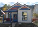 Charming home with colorful accents, inviting front porch, and cozy curb appeal at 215 Colorado Blvd, Idaho Springs, CO 80452