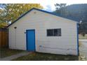 Detached garage offers ample storage and parking space, adding convenience and functionality at 215 Colorado Blvd, Idaho Springs, CO 80452