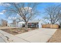 Charming single Gathering home showcasing its long driveway and pleasant neighborhood at 1780 S Umatilla St, Denver, CO 80223