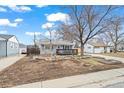 Charming single Gathering home featuring a well-manicured front yard at 1780 S Umatilla St, Denver, CO 80223