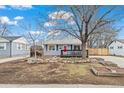Charming single Gathering home with natural rock landscaping in the front yard at 1780 S Umatilla St, Denver, CO 80223