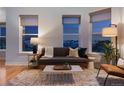 Cozy living room featuring large windows with city views and a comfortable seating arrangement at 2240 N Clay St # 501, Denver, CO 80211