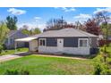 Charming single story home featuring a carport and well-maintained front yard at 2205 S Irving St, Denver, CO 80219