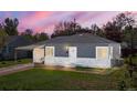 Charming single story home featuring a carport and well-maintained front yard at 2205 S Irving St, Denver, CO 80219