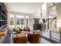 Bright foyer with high ceilings, modern lighting, and comfortable seating, creating a welcoming entrance at 1009 Monarch Way, Superior, CO 80027