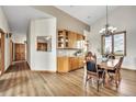 Elegant dining room with wooden table, traditional chandelier and views of the outdoors at 15125 Spring Valley Rd, Larkspur, CO 80118