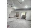 Spacious unfinished garage with high ceilings, offering ample potential for customization and storage at 8985 Lander St, Westminster, CO 80031