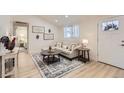 Cozy living room with modern decor, featuring a comfortable sofa and stylish coffee tables at 8985 Lander St, Westminster, CO 80031