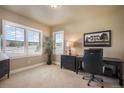 Bright office with plush carpet, natural light, plantation shutters, and neutral paint palette create a serene workspace at 17275 Gwilym Ct, Monument, CO 80132