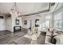 Sunlit living room with hardwood floors and comfortable seating at 277 N Broadway # 208, Denver, CO 80203