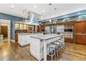 Spacious kitchen with double islands, premium stainless appliances, hardwood flooring and ample cabinetry at 235 Eudora St, Denver, CO 80220