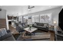 Inviting living room featuring plush sofas, modern decor, and ample natural light at 6954 E 117Th Ave, Thornton, CO 80233