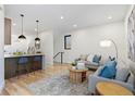 Bright living room with hardwood floors and modern furniture creating an inviting and comfortable space at 1715 Grove St, Denver, CO 80204