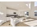 Modern kitchen featuring an island, stainless steel appliances, and an open floor plan at 39856 Floyd St, Elizabeth, CO 80107