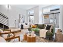 Inviting living room featuring natural light, hardwood floors, stylish furniture, and contemporary design at 4044 W 16Th Ave, Denver, CO 80204