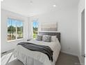 Bright bedroom with large windows and neutral color scheme at 1998 S Poplar Ct, Denver, CO 80224