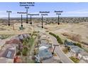 An aerial view of a neighborhood including community park, pickleball, baseball, basketball and soccer field amenities at 7329 Arco Iris Ln, Castle Pines, CO 80108