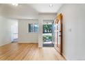 Bright entryway with wood floors and a view to the front yard at 8813 Baseline Rd, Lafayette, CO 80026