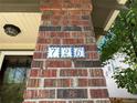 The house number '726' in decorative blue and white tiles on a brick pillar adds a unique touch at 726 S Corona St, Denver, CO 80209