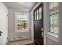 Bright entryway featuring decorative glass windows and a dark wood door with sidelights at 726 S Corona St, Denver, CO 80209