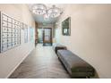 Clean and spacious hallway with mailboxes and comfortable seating at 180 Cook St # 105, Denver, CO 80206
