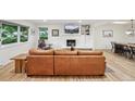 Bright living room features a stone fireplace, hardwood floors, and modern decor at 632 Wyoming St, Golden, CO 80403