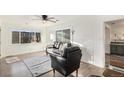 Living room with hardwood floors, comfy seating and access to the kitchen at 1961 W Kentucky Ave, Denver, CO 80223