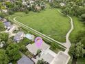 An aerial view highlights the home's proximity to walking trails and green space in a vibrant neighborhood at 11762 W 34Th Ave, Wheat Ridge, CO 80033