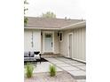 A cozy outdoor sitting area is adjacent to the front door and entry way at 11762 W 34Th Ave, Wheat Ridge, CO 80033