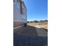 Spacious backyard with newly installed grass and a view of the surrounding community at 16562 E 109Th Ave, Commerce City, CO 80022