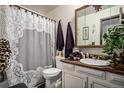Bathroom with vanity and decorative shower curtain at 2813 S Xanadu Way, Aurora, CO 80014
