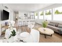 Inviting open-concept living space with modern decor, kitchen island, and bright, airy atmosphere at 5462 S Cedar St, Littleton, CO 80120