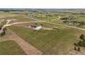 Aerial view of the property showing a large home, outbuildings and vast greenery at 6785 Arrowhead Cir, Elizabeth, CO 80107