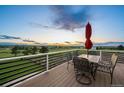 Outdoor dining on this back deck with distant views, perfect for entertaining or relaxing with Gathering and friends at 6785 Arrowhead Cir, Elizabeth, CO 80107