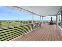 Outdoor deck with scenic views of the surrounding landscape, perfect for relaxation and outdoor dining at 6785 Arrowhead Cir, Elizabeth, CO 80107