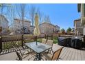 Outdoor deck featuring patio dining set and barbecue, perfect for outdoor gatherings at 24702 E Hoover Pl, Aurora, CO 80016