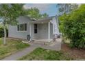 Inviting single-story home entrance featuring a covered porch at 3256 S Ogden St, Englewood, CO 80113