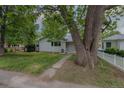 Single-story home with lawn and mature trees at 3256 S Ogden St, Englewood, CO 80113
