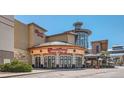 The Cheesecake Factory Restaurant with ample parking, outdoor seating, and well landscaped entryway at 7307 Waterleaf Trl, Littleton, CO 80125