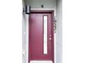 Elegant front door with glass window and visible house number, framed by modern lighting at 19221 E 65Th Ave, Denver, CO 80249
