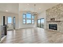 Living space boasting hardwood floors, fireplace, and large windows at 1740 Joseph Cir, Elizabeth, CO 80107