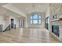 Living space features hardwood floors, fireplace, and large windows providing ample natural light at 1740 Joseph Cir, Elizabeth, CO 80107
