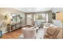 Cozy living room with hardwood floors, a large window, and stylish decor at 1060 S Harrison St, Denver, CO 80209