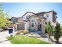 Attractive two-story house with stone accents, a landscaped yard, and a 'coming soon' sign at 15194 W Washburn Ave, Lakewood, CO 80228