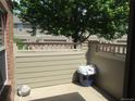 A private patio area enclosed by a fence, perfect for relaxing or entertaining outdoors at 569 Alton Way # E, Denver, CO 80230